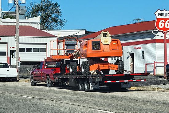 A car transporting a towable aerial